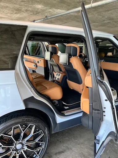 Tan leather seats in a white vehicle